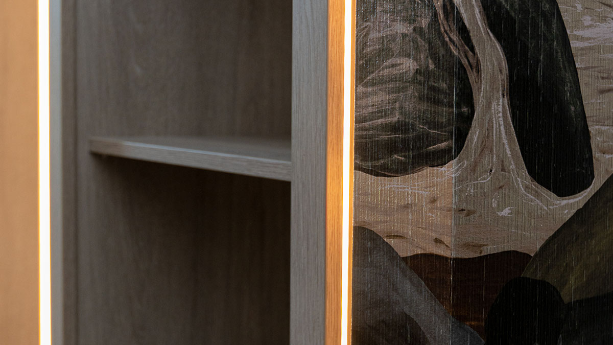 London Flat Dressing Room - Integrated Lighting Close-up of custom lighted shelving in a professionally furnished London flat dressing room, highlighting modern design