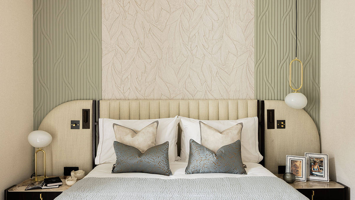 Luxury bedroom with upholstered headboard, textured feature wall, and soft neutral bedding with decorative cushions